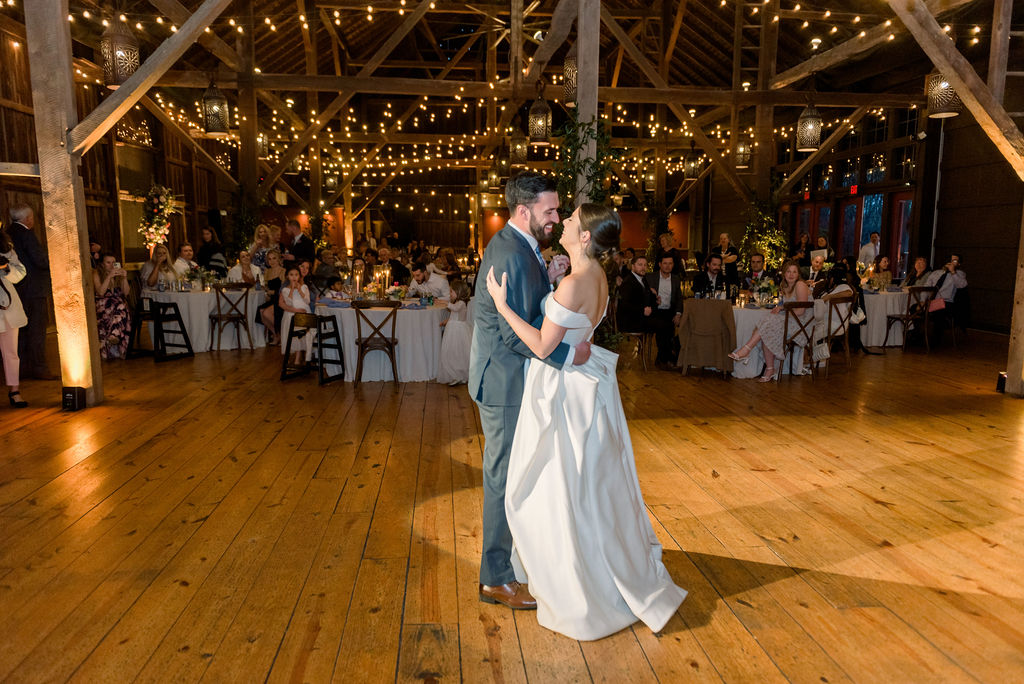 Bride and Groom first dance during reception at Riverside on the Potomac Virginia barn wedding venue